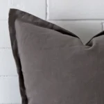 Close up image of top corner of this large grey cushion. This shows the linen fabric up close.