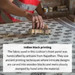 Person hand stamping a design into block printed fabric.