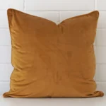 An alluring velvet large cushion cover in honey mustard.
