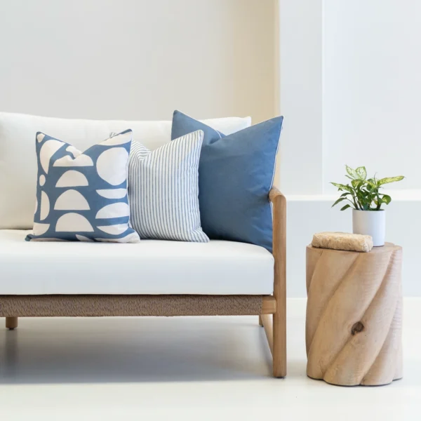 3 outdoor couch cushions in a horizon blue colour shown on a seat.