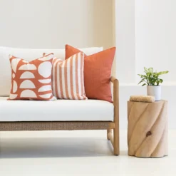 Outdoor living room with the horizon rust outdoor couch cushions set on it.