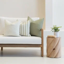 3 horizon sage outdoor couch cushions sitting on a white couch.