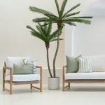 White sofa in an outdoor living room showing 4 horizon sage outdoor cushions.