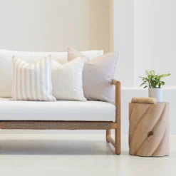 A white couch with the set of horizon sand couch cushions.