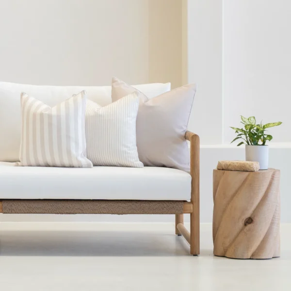 A white couch with the set of horizon sand couch cushions.