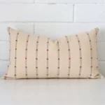 A hero shot of a striped rectangle cushion cover. It is made from a deluxe designer fabric.