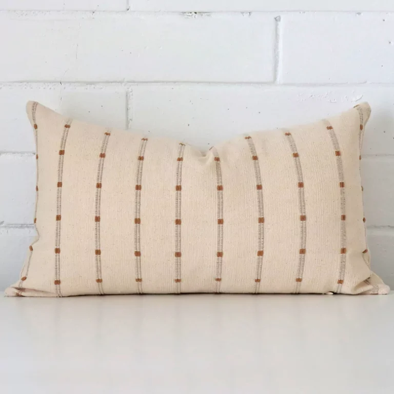 A hero shot of a striped rectangle cushion cover. It is made from a deluxe designer fabric.