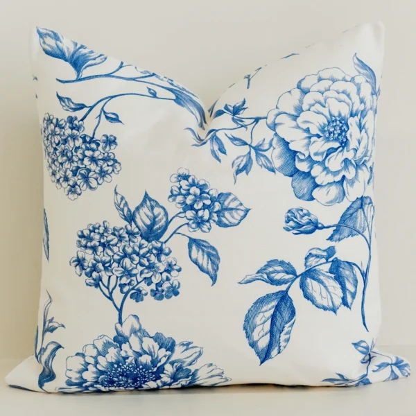 Cream cushion cover with blue hand-drawn floral illustration, large size.