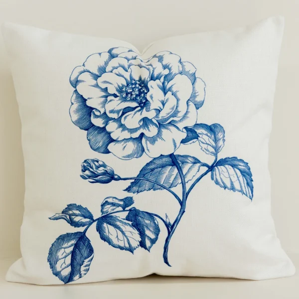 Blue statement floral cushion cover on cream cotton-linen fabric.