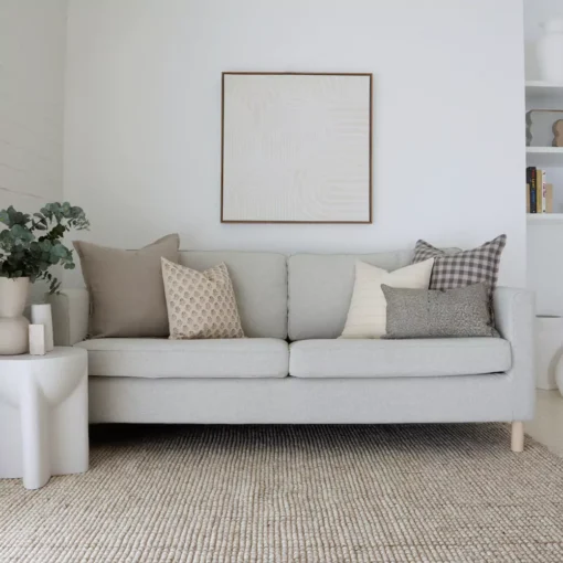 The elegant Jude sofa cushions, a set of 5 designer cushions gives the stylish look of a grey sofa in a living room.