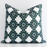 A premium dark green outdoor cushion boasting a geometric design and in a square shape.