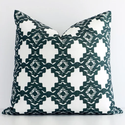 A premium dark green outdoor cushion boasting a geometric design and in a square shape.