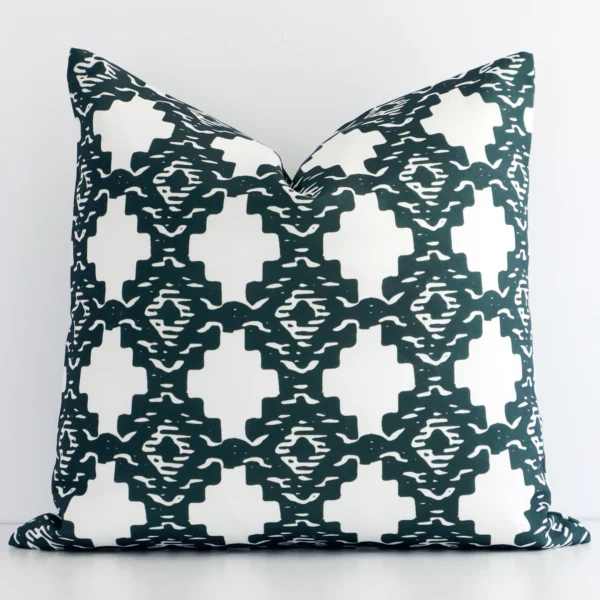 A premium dark green outdoor cushion boasting a geometric design and in a square shape.
