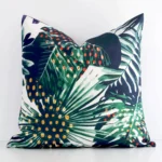 Gorgeous square outdoor cushion cover that has a graceful tropical design.