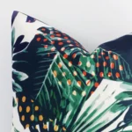 A macro image of the top left corner of this tropical outdoor cushion. It is possible to see the finer detail of the square shape.