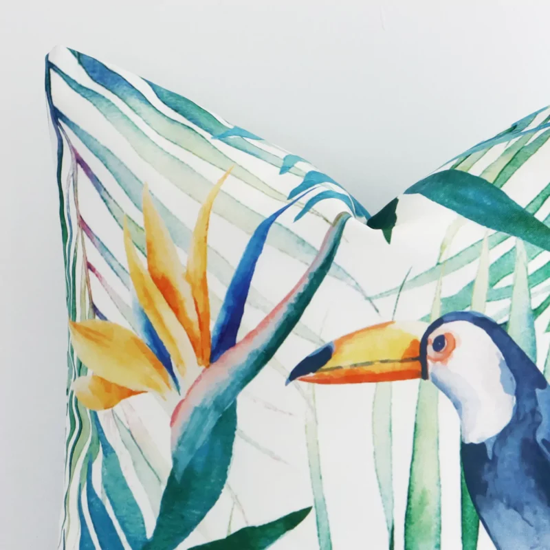 Precision shot of this square cushion cover. It is possible to see the toucan and leaf printed on its outdoor fabric in greater depth.