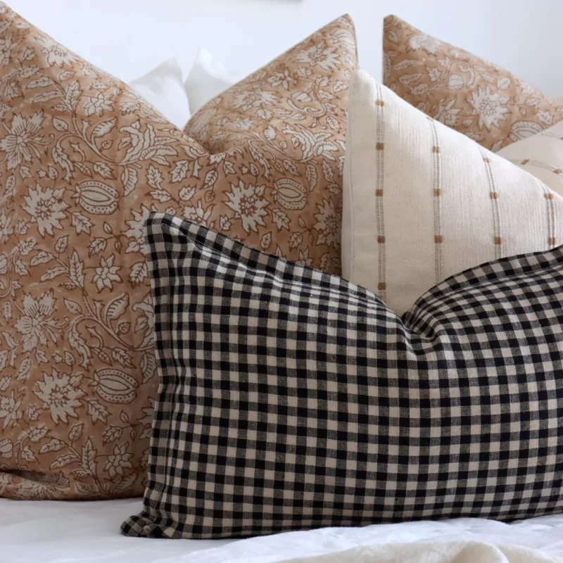 A close-up shot of 4 designer bed cushions from the Hunter set.