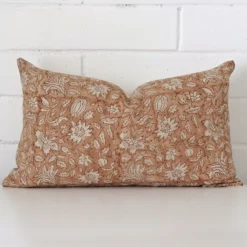 A stunning rectangle designer cushion. It has an exquisite floral design.