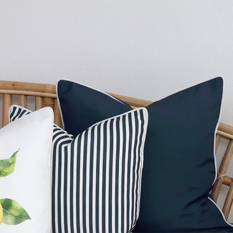 The details are magnified in this close-up view of 3 navy outdoor couch cushions.