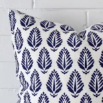 Close up image of top corner of this geometric blue cushion. This shows the linen fabric and large shape up close.