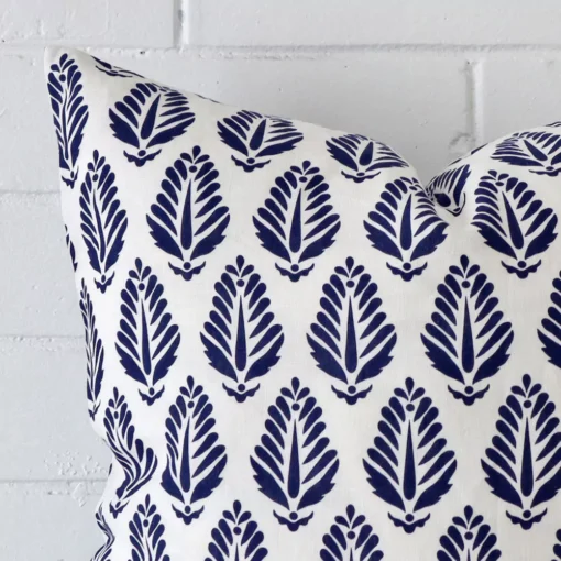 Close up image of top corner of this geometric blue cushion. This shows the linen fabric and large shape up close.
