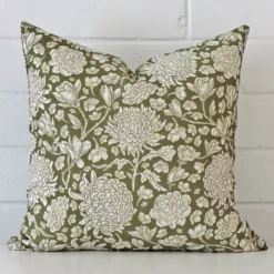 A hero shot of a floral square cushion cover. It is made from a deluxe linen fabric and features a green colour.