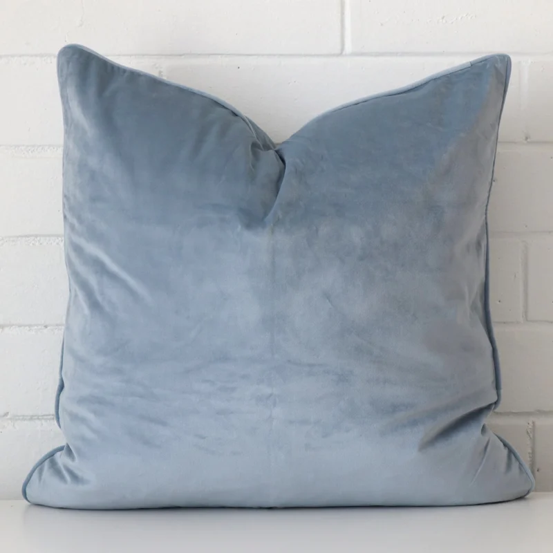 light-blue-velvet-cushion-cover-55cm-x-55cm-sc773-55b Here a light blue velvet cushion is shown styled against a white wall. It has a large size.