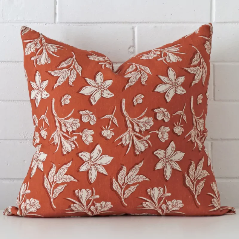 liza-linen-rust-floral-cushion-cover-large-sc1022-55 Rust floral cushion leans elegantly against a brick wall. It has been crafted from a high quality linen material and has a large size.