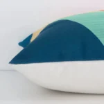 Square linen cushion cover positioned flat to show seams. The colourful hue and geometric design are shown between front and rear fabric panels.
