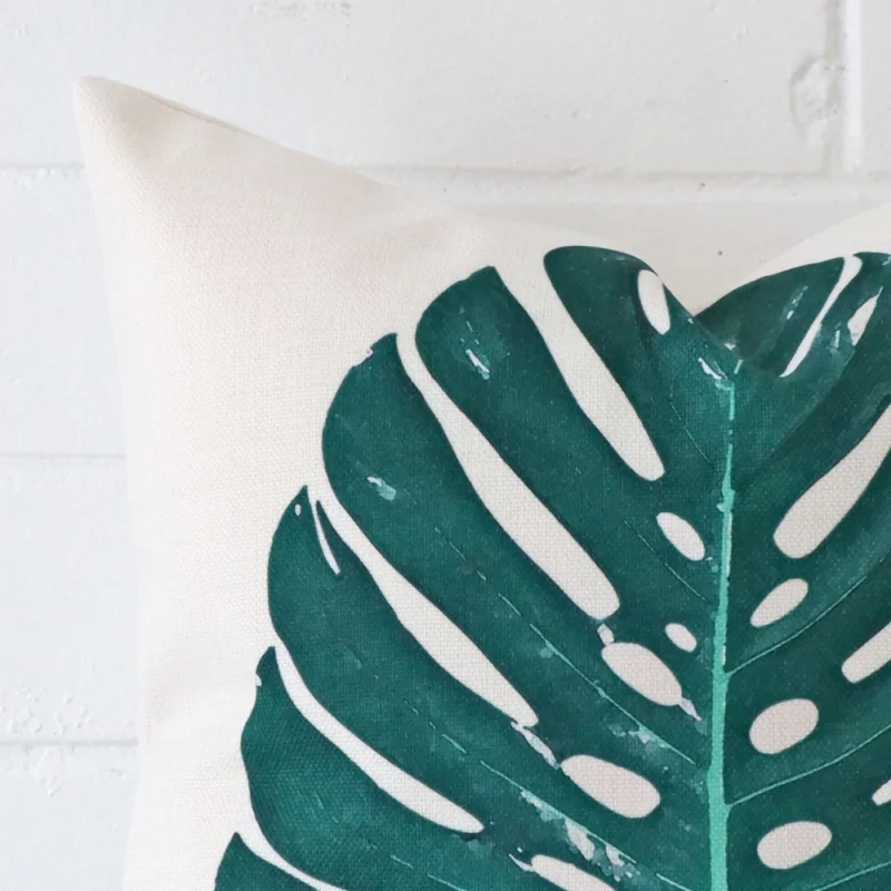 A close up shot showing the top left side of this square linen cushion cover. The design is magnified.