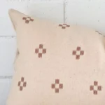 A zoomed view of this designer cushion’s corner that has a rectangle size.