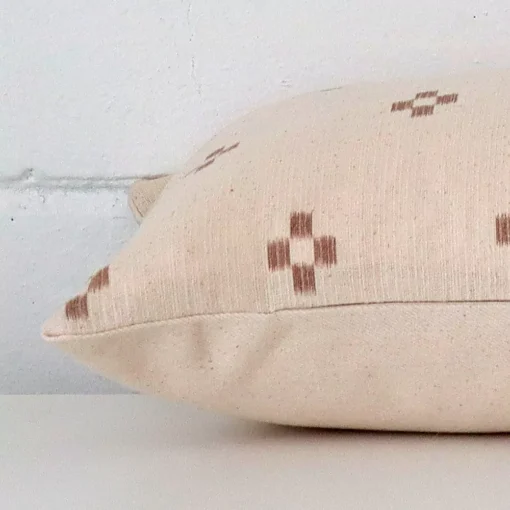 Side shot showing the seam of this rectangle cushion that is made from a designer material.