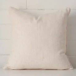 An alluring linen square cushion cover in cream.