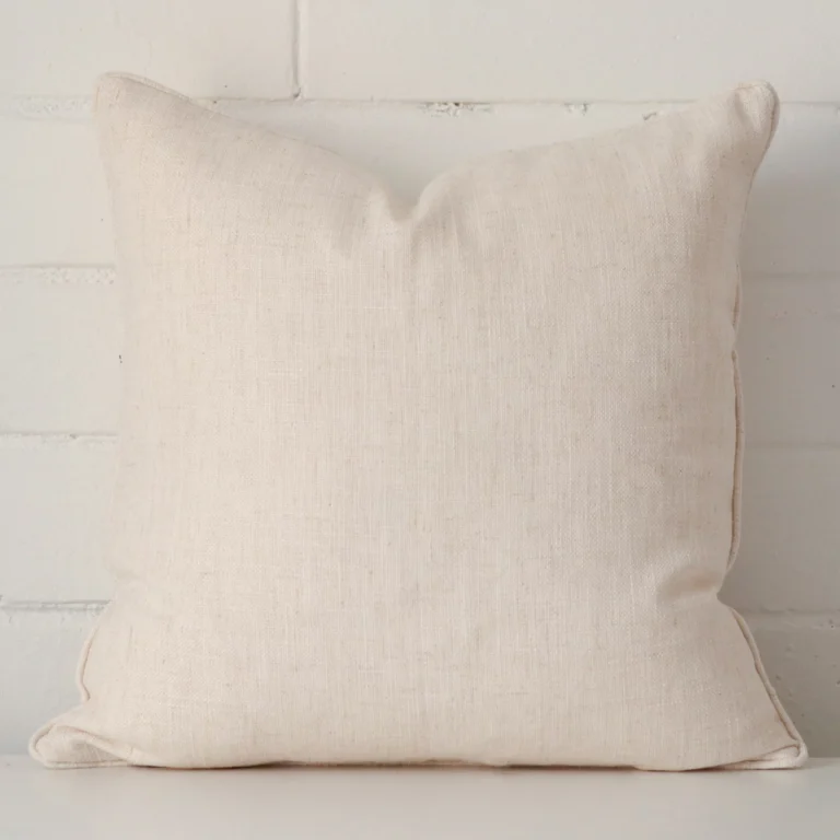 An alluring linen square cushion cover in cream.