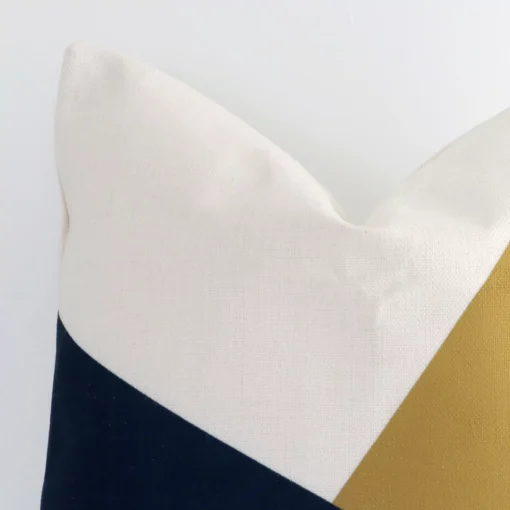 A detailed shot of this colourful geometric cushion cover that has linen fabric and a square shape.