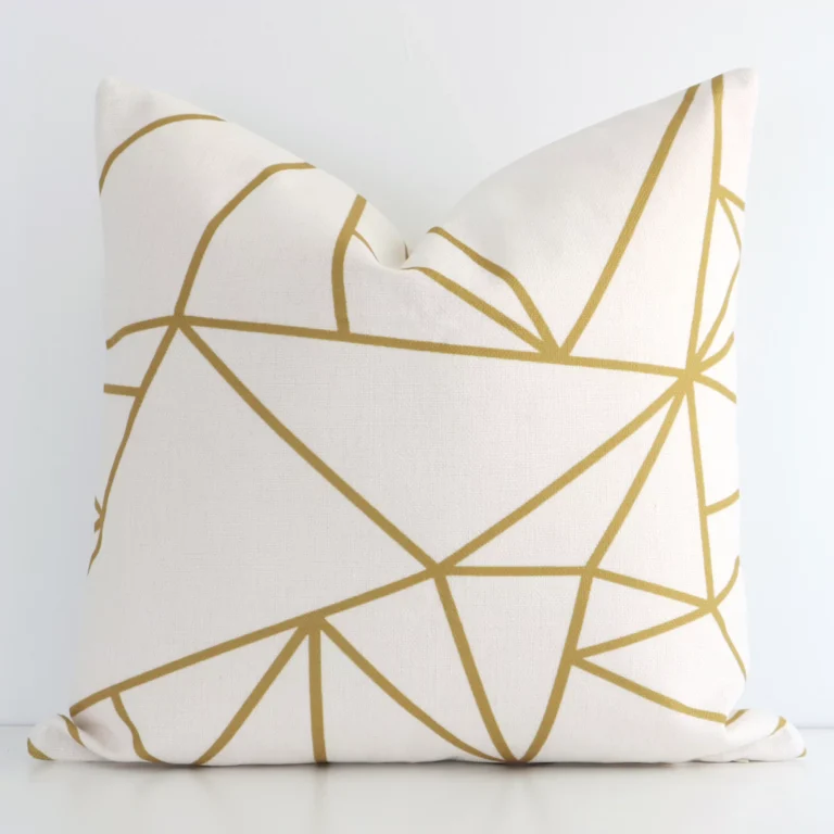 Charming geometric cushion with a gold mustard print cover constructed from linen fabric and shown in a square shape.