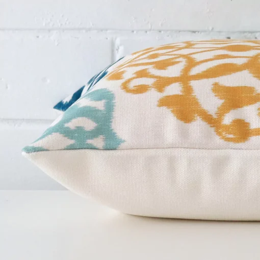 Side image of a linen square cushion cover. The patterned design is visible from the side showing the attachment of the panels.