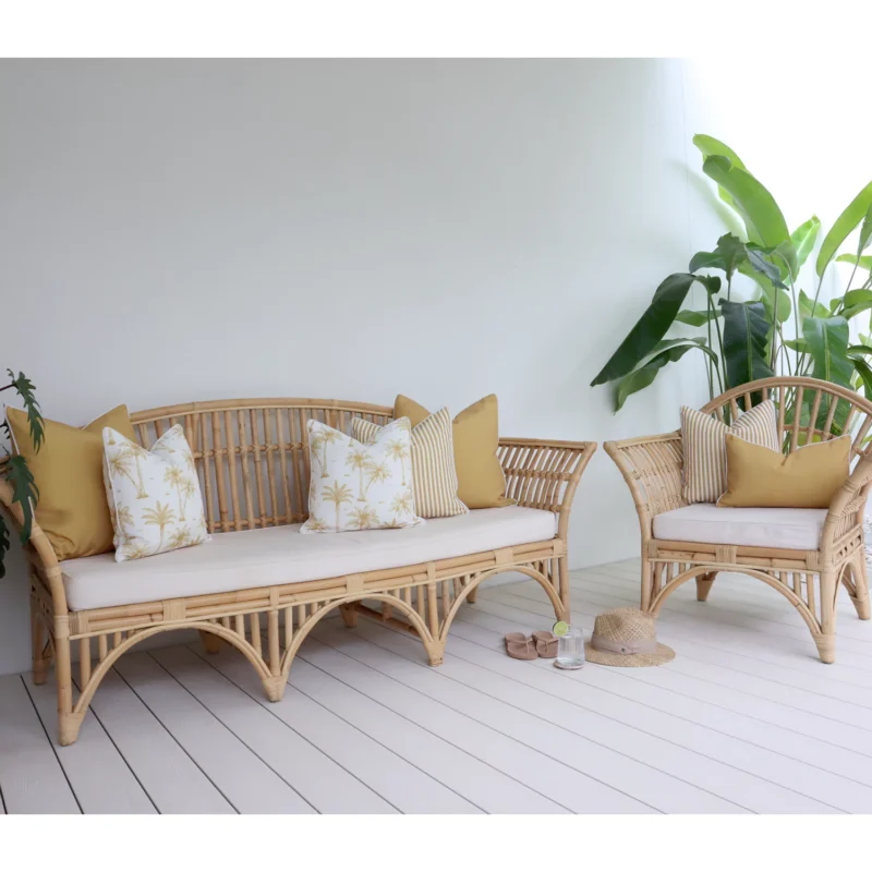 A lovely combination of 7 outdoor mustard lounge cushions in a cozy lounge.