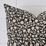 Enlarged shot of a large cushion cover that highlights that floral motif on its designer fabric.