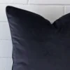 Close up image of top corner of this navy cushion. This shows the velvet fabric and large dimensions up close.