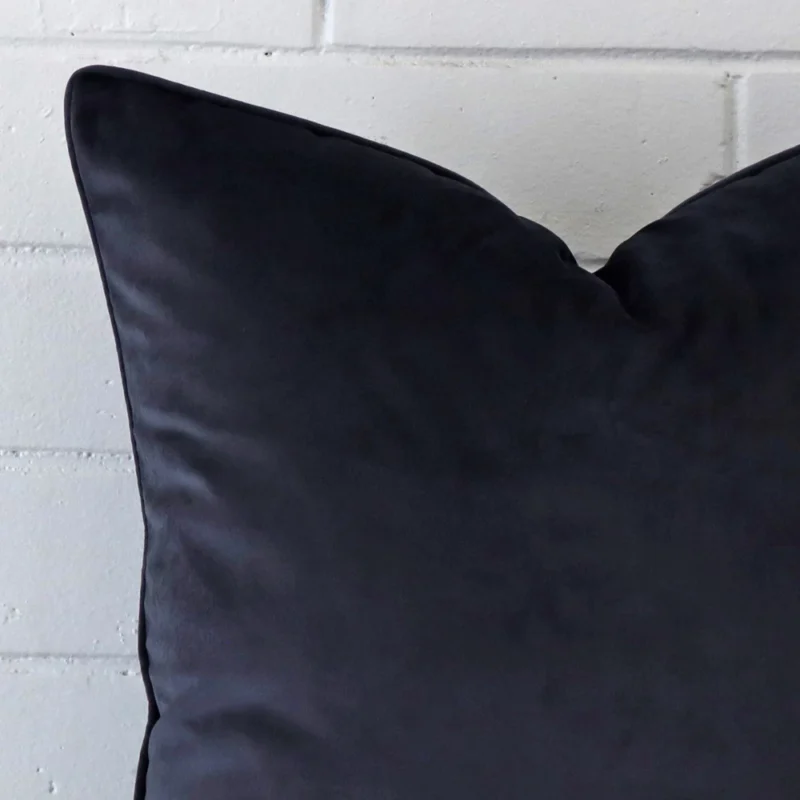 Close up image of top corner of this navy cushion. This shows the velvet fabric and large dimensions up close.