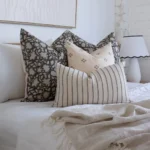 Close range image of 4 designer bed cushions from the Nellie bed set.