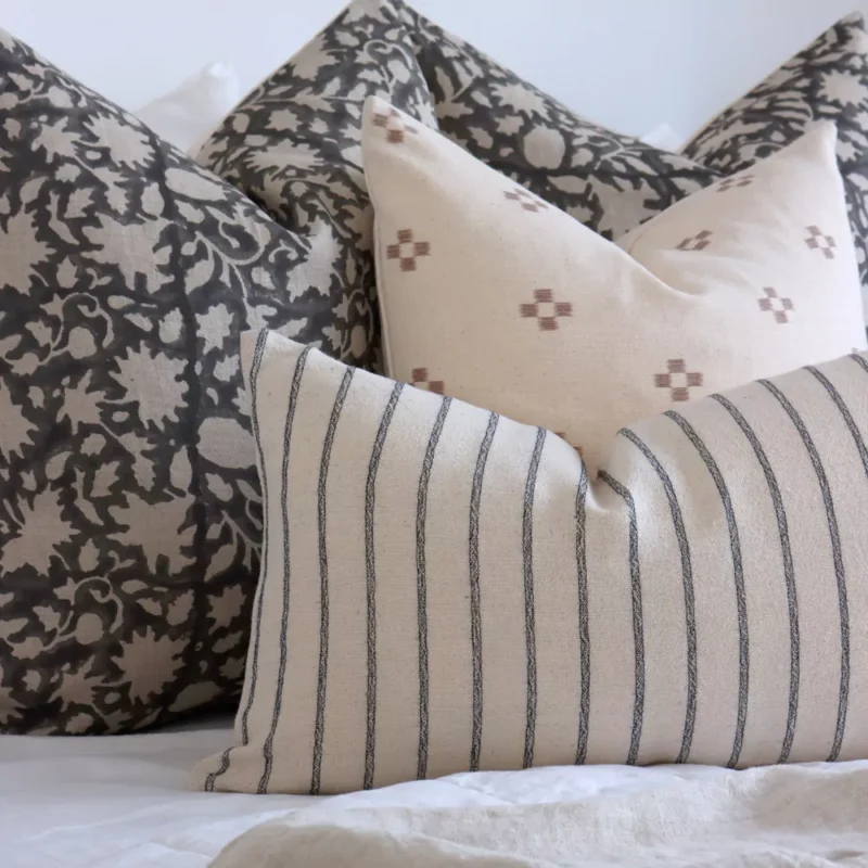 A close up shot of 4 designer bed cushions magnifying their colours and designs.
