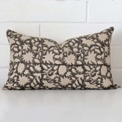 Vibrant floral cushion cover constructed from designer fabric and shown in a rectangle shape.