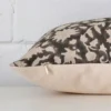Side angle of floral cushion cover that has designer fabric and a rectangle size.