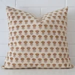 A hero shot of a floral large cushion cover. It is made from a deluxe designer fabric.