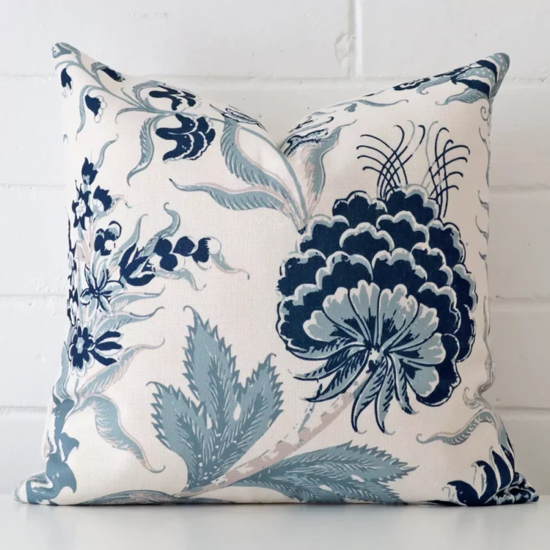 new-england-botanic-cushion-cover-45cm-x-45cm-sc826-45 A pretty floral linen cushion cover is shown against a brick wall. It features a square shape.
