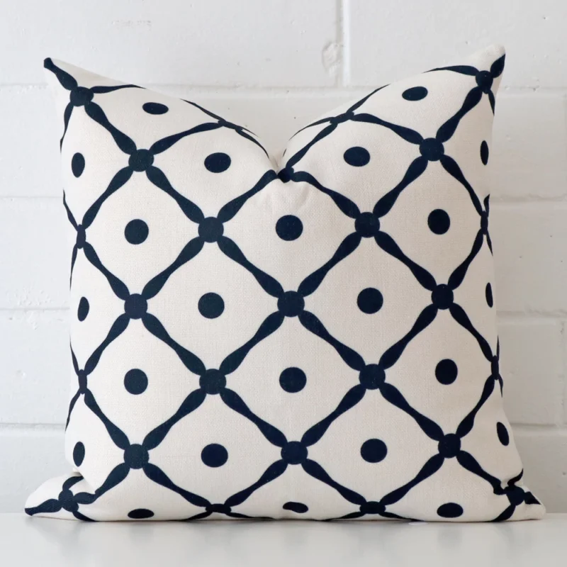 new-england-lattice-cushion-cover-45cm-x-45cm-sc620-45 Cushion positioned in front of a brick wall. It has square dimensions and is made from a linen material.