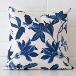 A hero shot of a floral square cushion cover. It is made from a deluxe linen fabric and features.