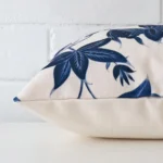 The seams of this linen square cushion cover is shown. The image shows the floral design and how the panels are attached.